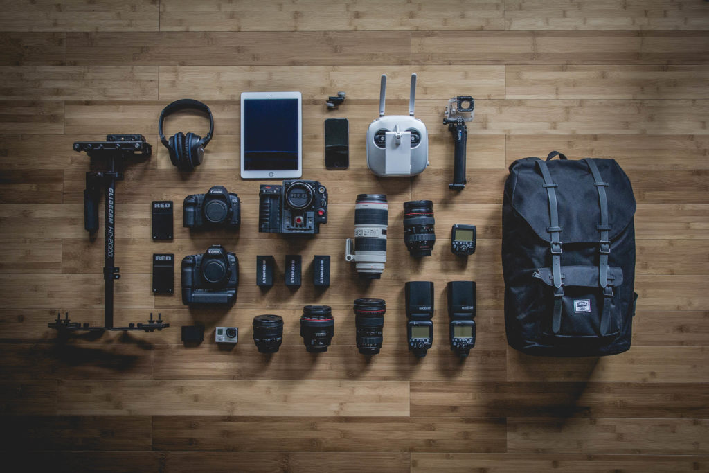 An image showing various camera equipment laid out in a structured manner. The point is to illustrate deconstruction